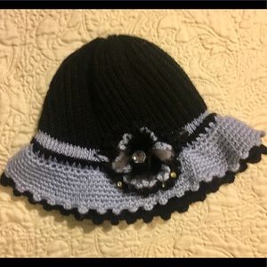 Knit hat w/ feathers & faux rhinestone accent